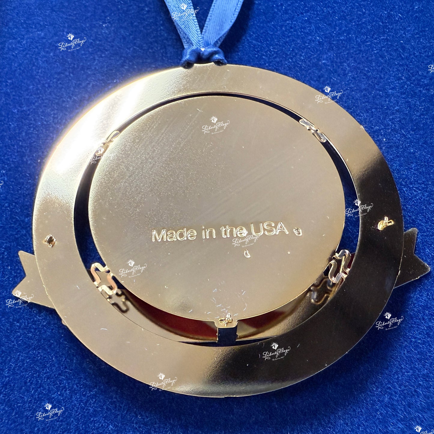 Back view of Celebrate America 250 ornament showing solid brass construction, gold finish, and Made in the USA