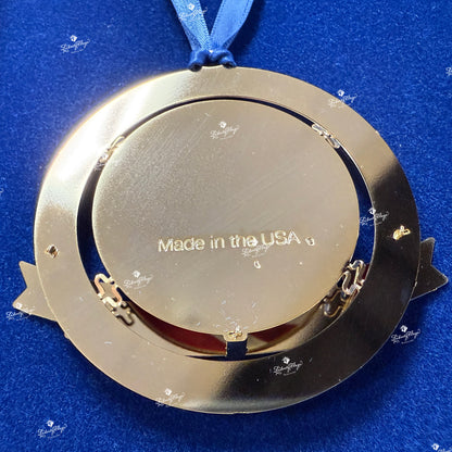 Back view of Celebrate America 250 ornament showing solid brass construction, gold finish, and Made in the USA